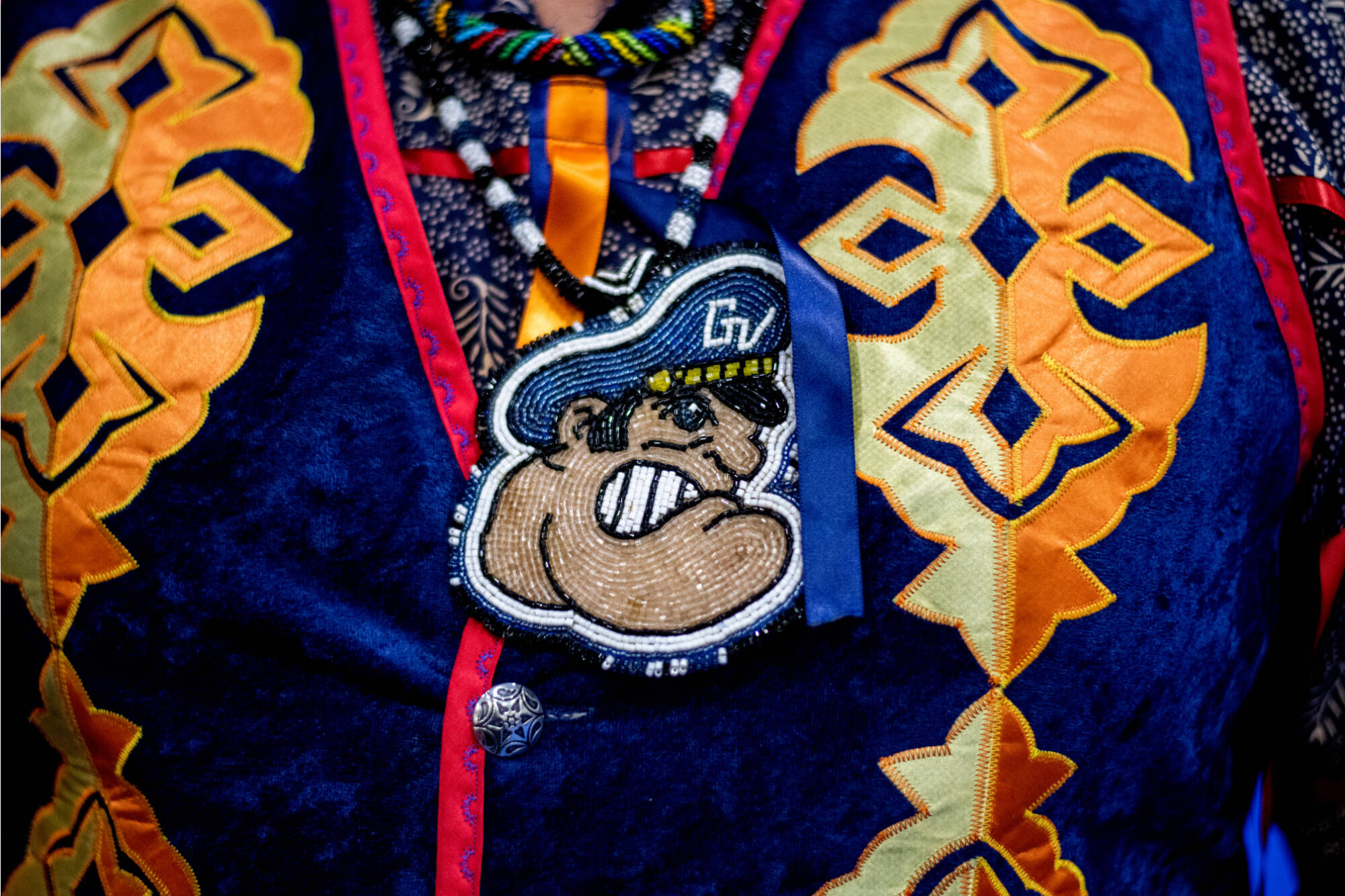 Jonathan Rinehart, an alumnus of GVSU, wears a beaded Louie the Laker with his regalia during the 22nd anniversary of the Celebrating All Walks of Life Pow Wow at GVSU’s Fieldhouse April 15.